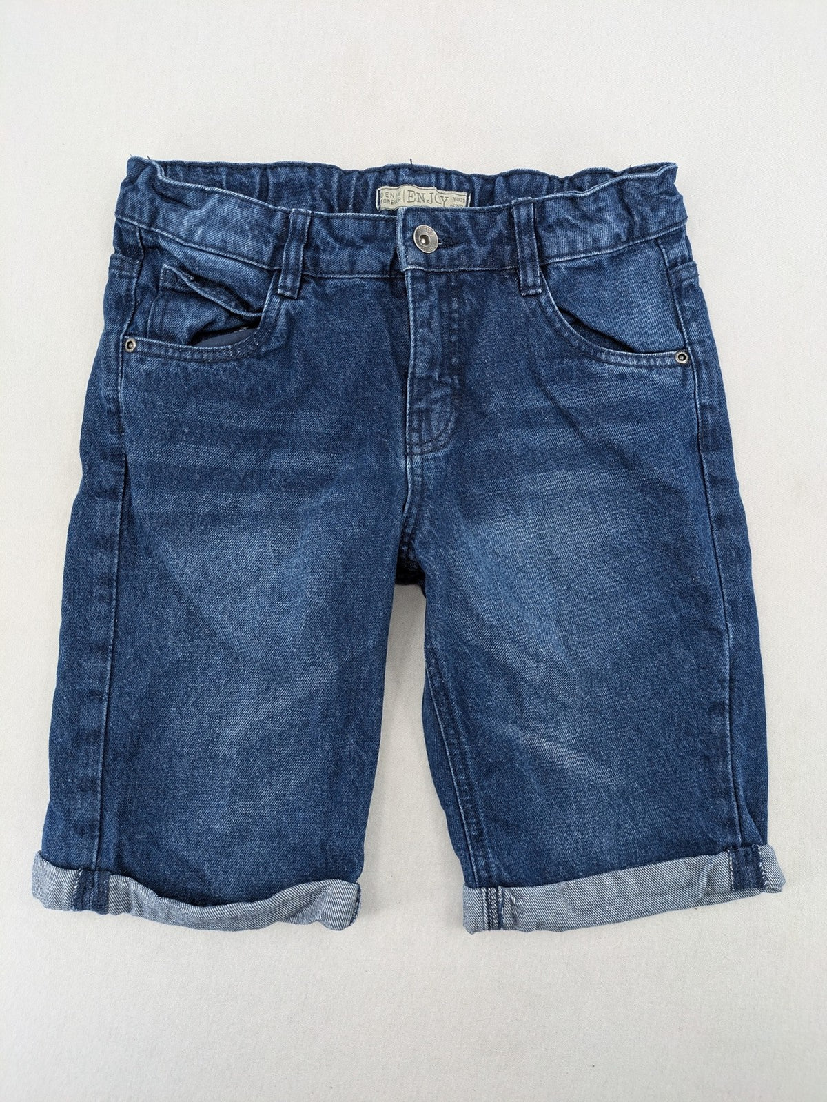Pocopiano blue denim shorts with rolled cuffs and elastic waistband for comfort.