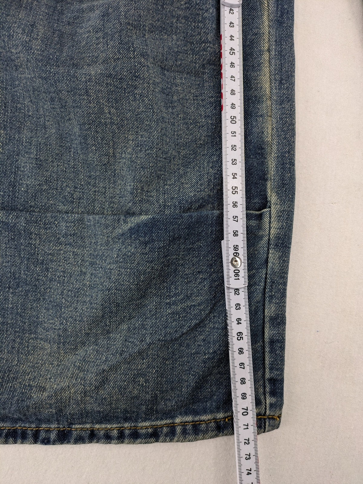 Baggy blue straight jeans wide leg with cargo pockets and elastic waistband.