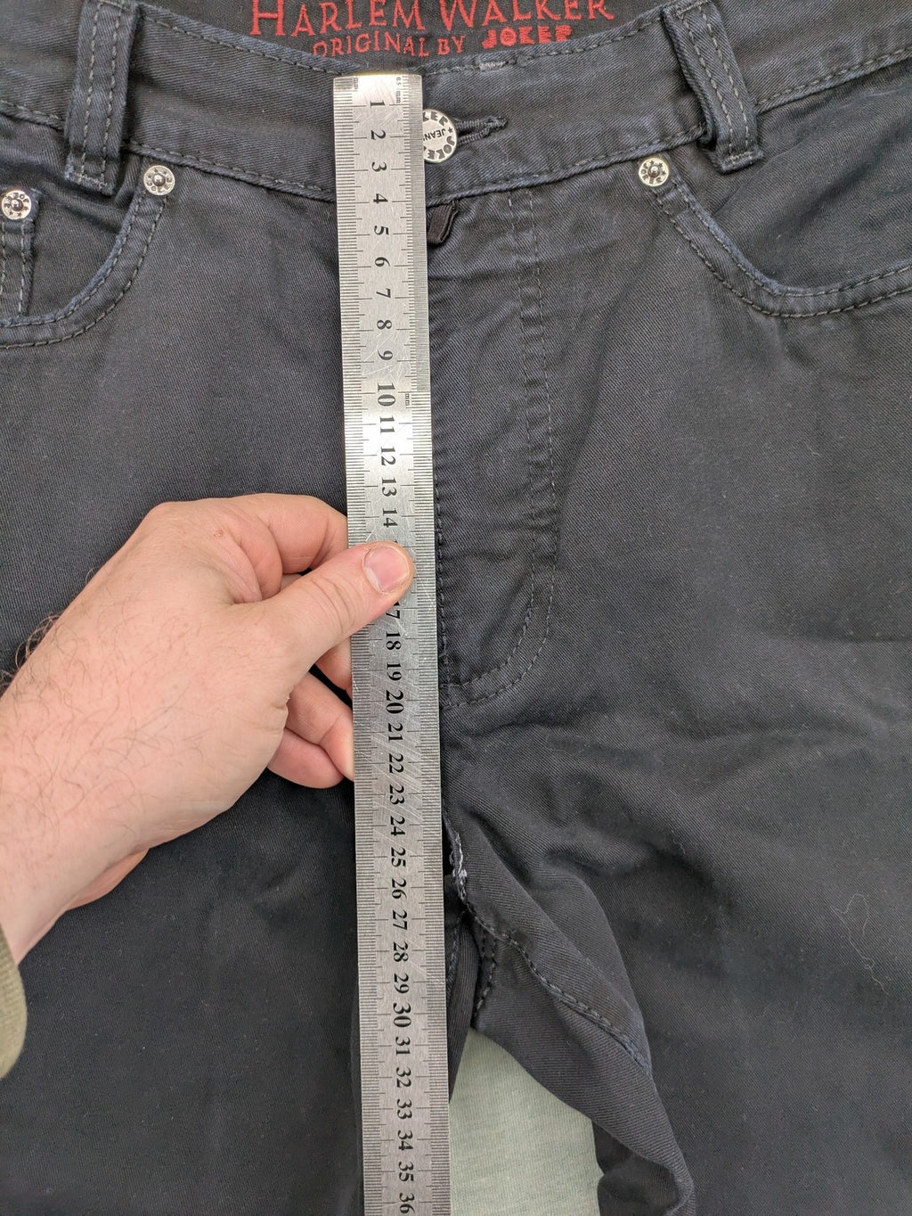 Joker black straight jeans five-pocket design with prominent stitching and brand details.