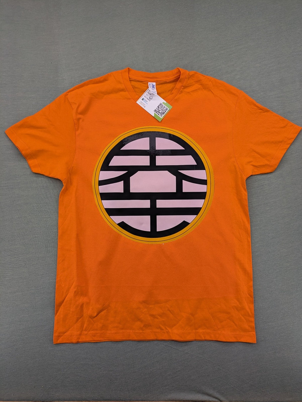 Dragon Ball Z orange t-shirt featuring 'Go' kanji symbol, made of soft cotton.