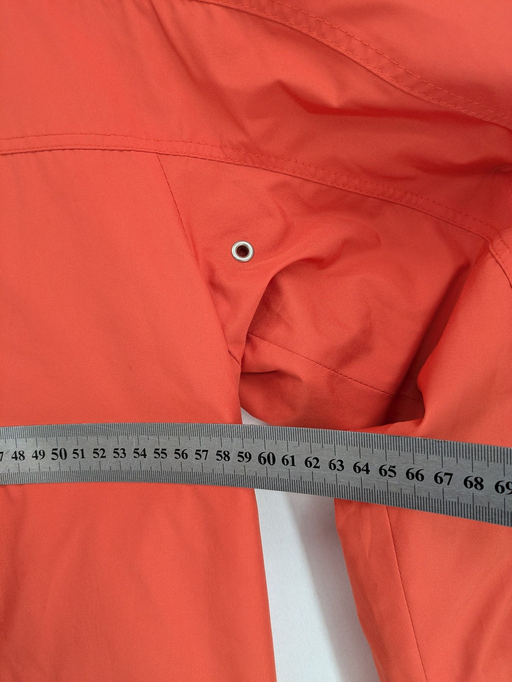 Sport Windbreaker orange jacket with adjustable hood, full zip, and button storm flap.