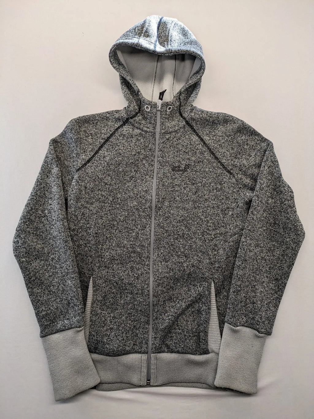 Jack Wolfskin grey fleece jacket with logo detailing and two front pockets.
