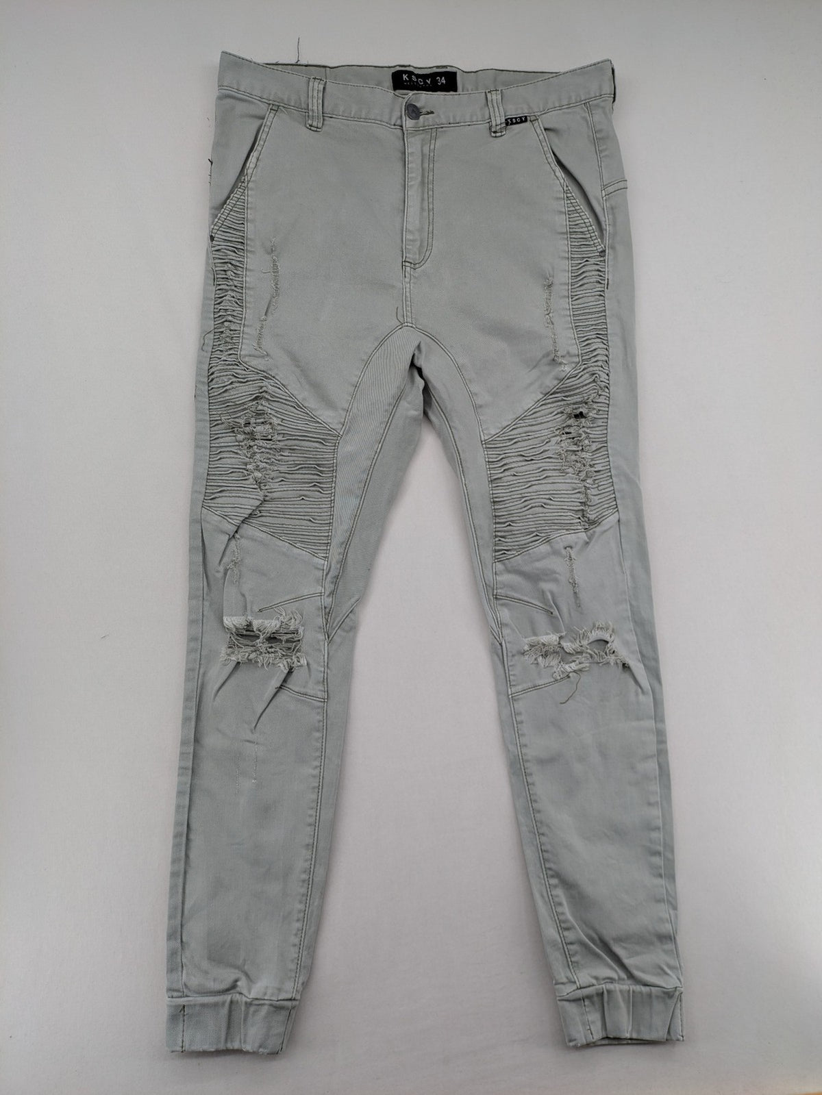 KSCY grey straight jeans with distressed details and ribbed biker inserts.