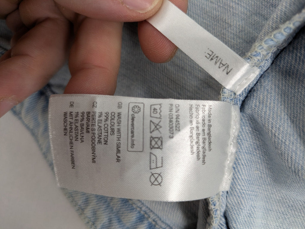 H&M denim jacket light blue classic trucker style with button placket and chest pockets.