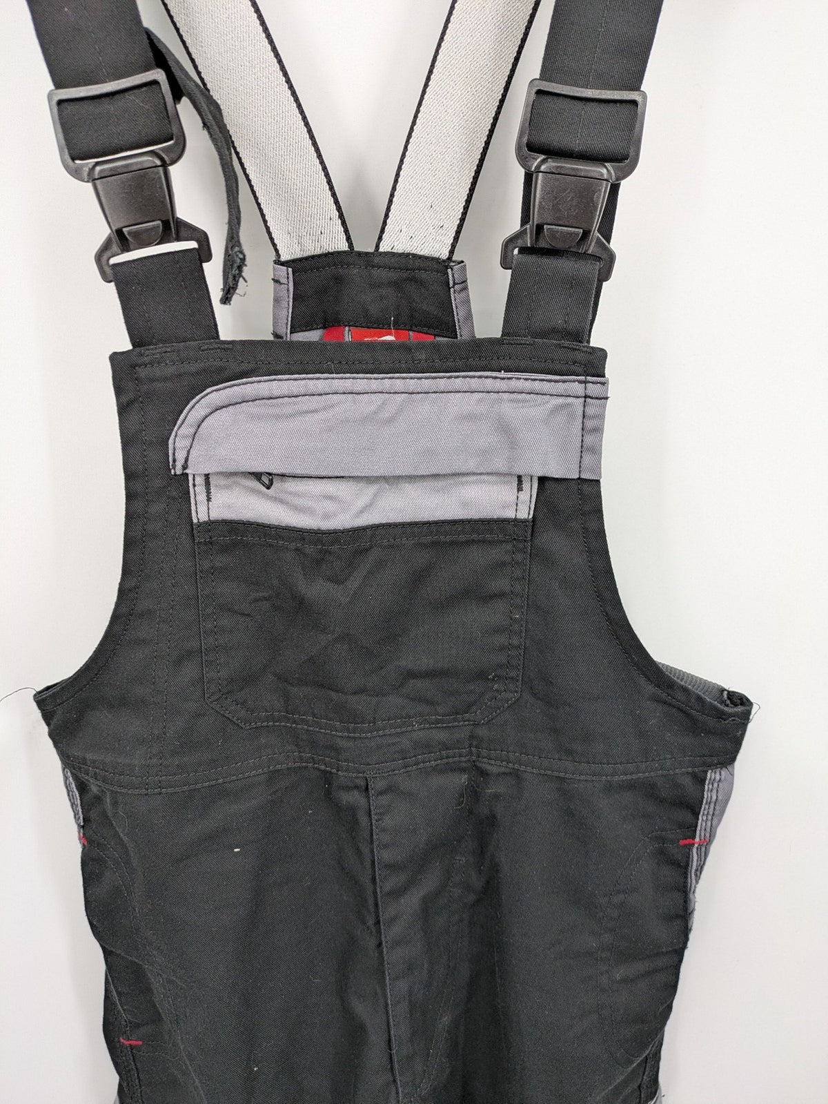 Cargo pants black grey two-tone design with red stitching and multiple pockets