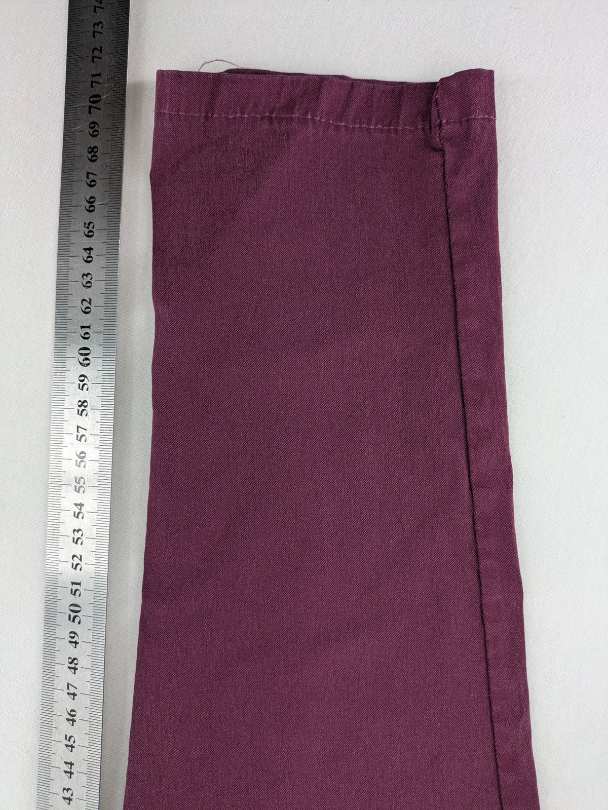 Pink Cherry pants pink stretchy fabric with decorative buttons and elastic waistband.