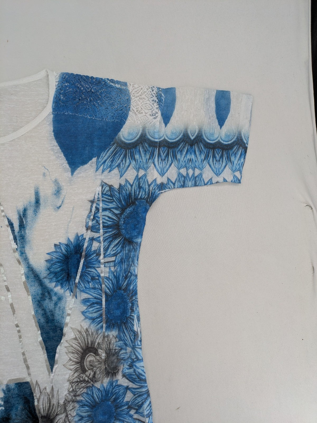 Liberty blue floral print top with metallic "LOVE" lettering, lightweight polyester material.