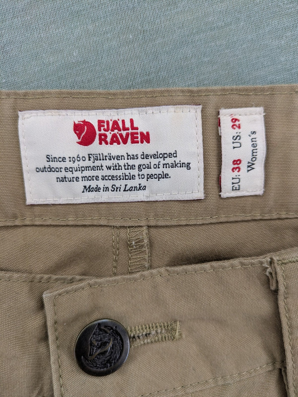 Fjällräven beige pants regular fit durable fabric outdoor style with logo detail.