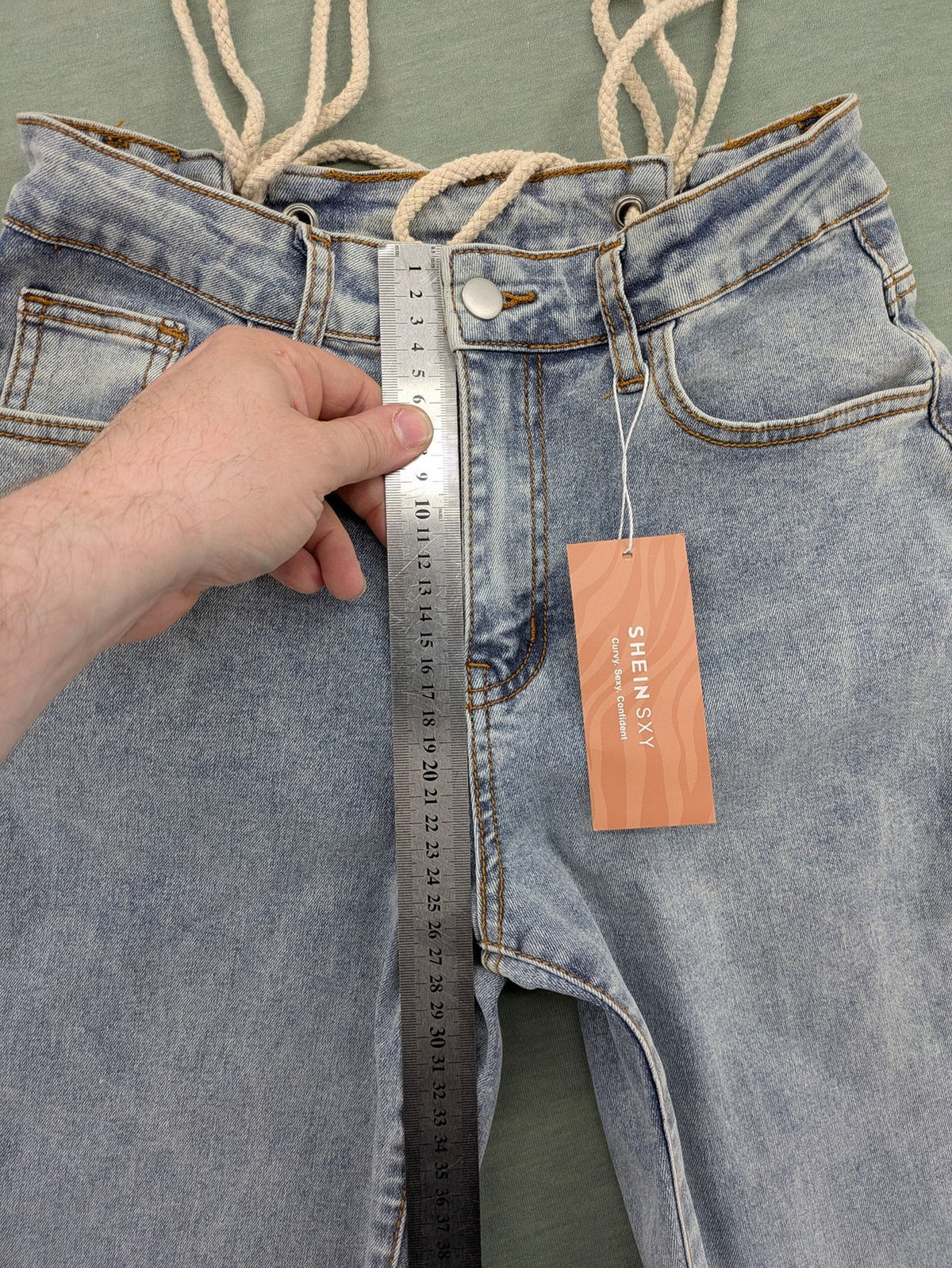 SHEIN blue straight jeans high waist with unique lacing details and stylish design.