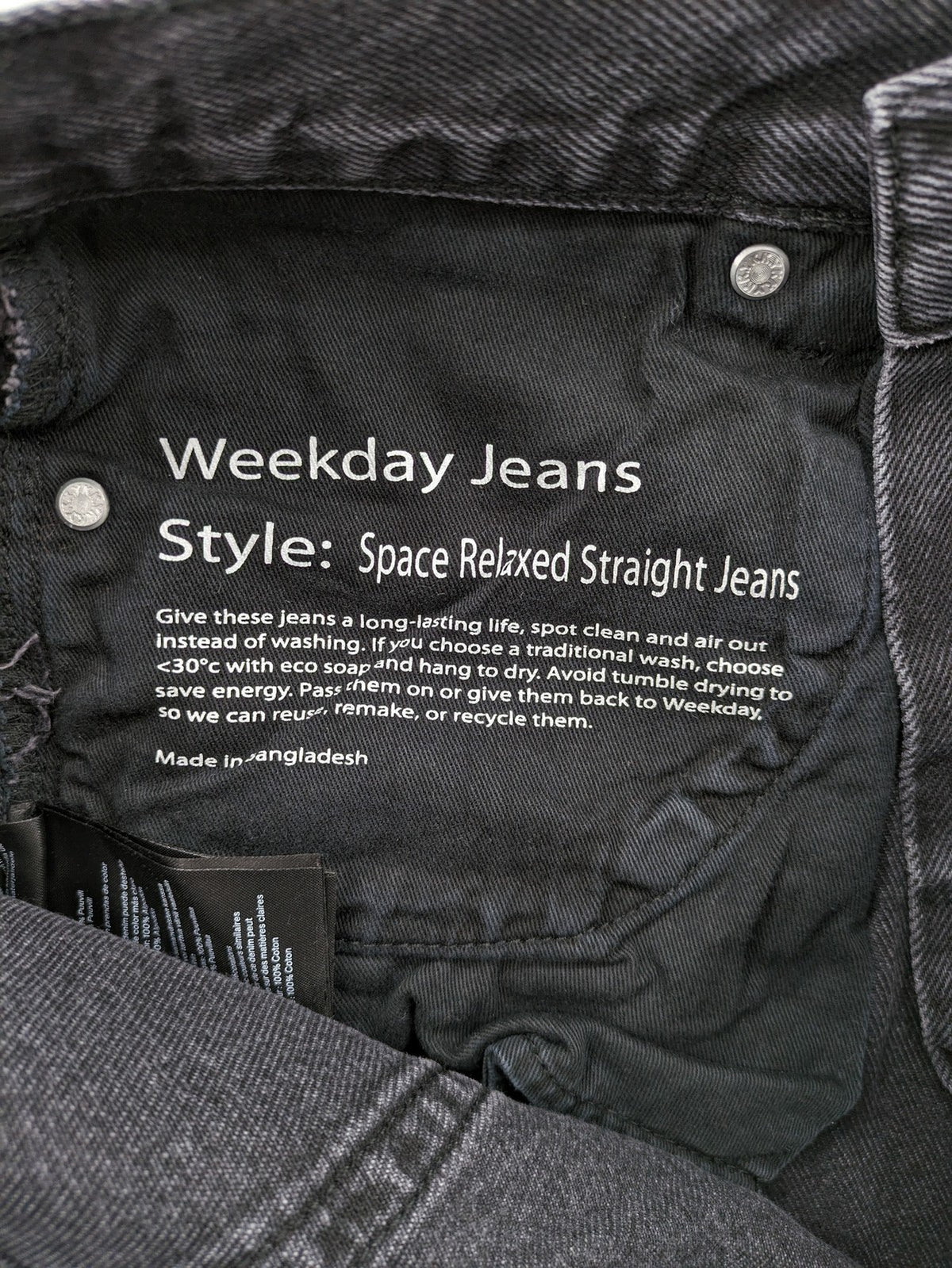 Weekday grey straight jeans with button fly and classic denim design.