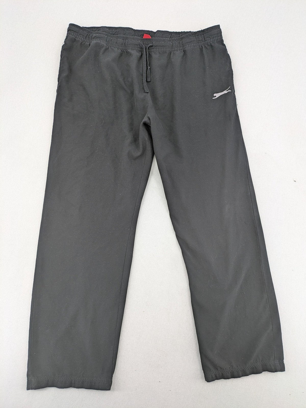 Slazenger grey loungewear joggers with adjustable drawstring and subtle logo on thigh.