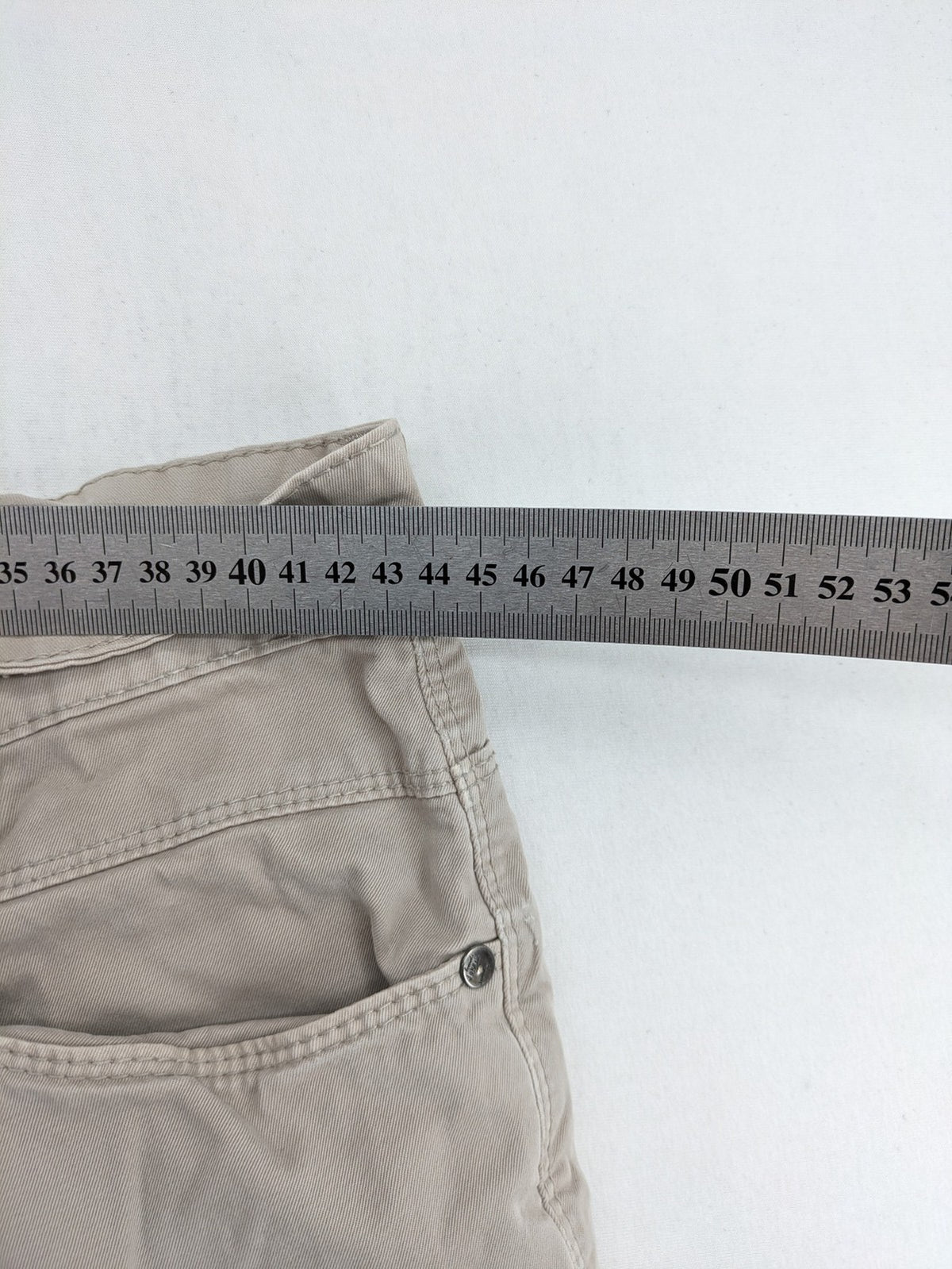 Joker beige chino pants 5-pocket design made from cotton stretch blend.
