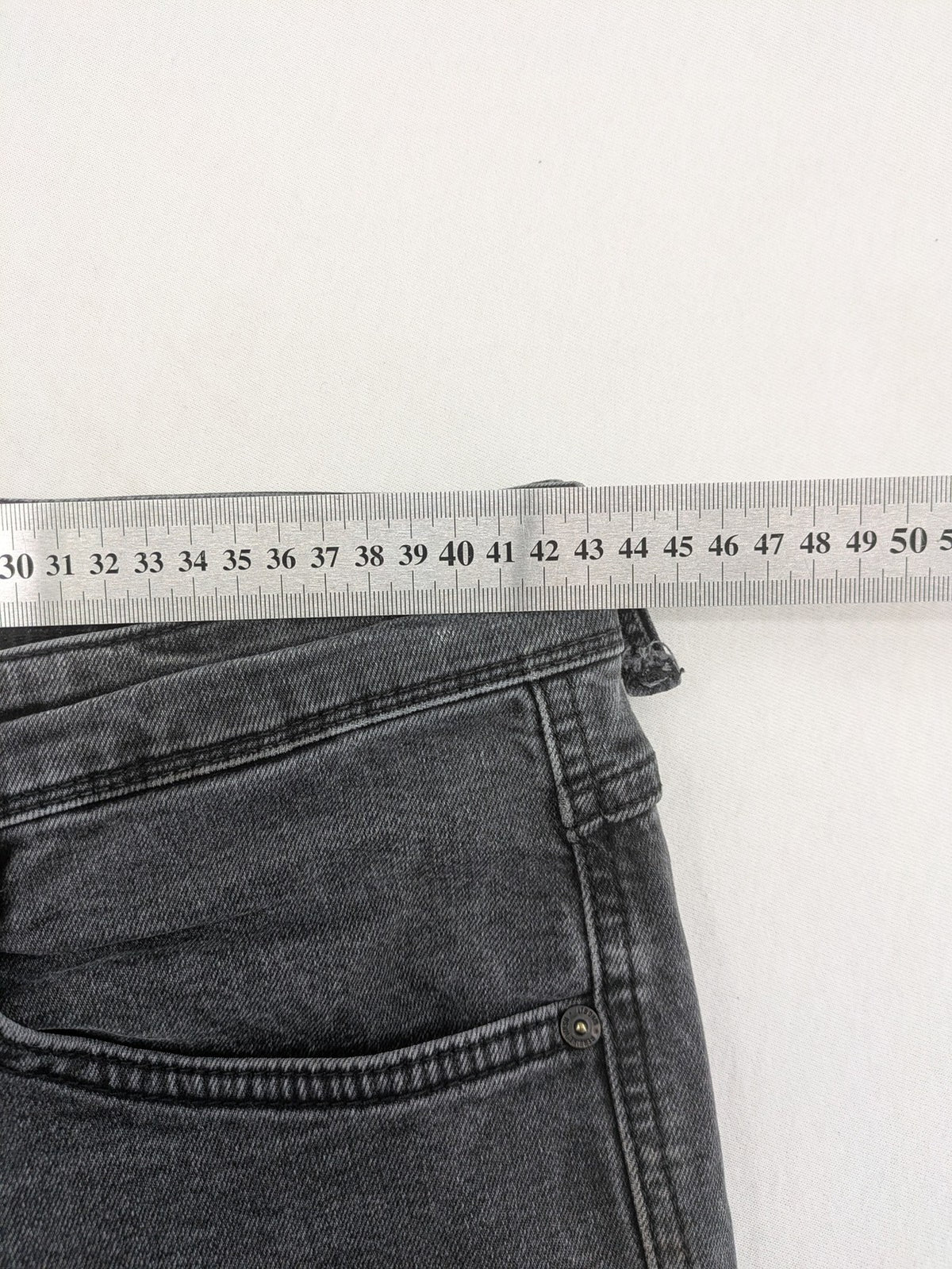 LTB grey slim tapered jeans with washed denim finish and subtle logo detail.