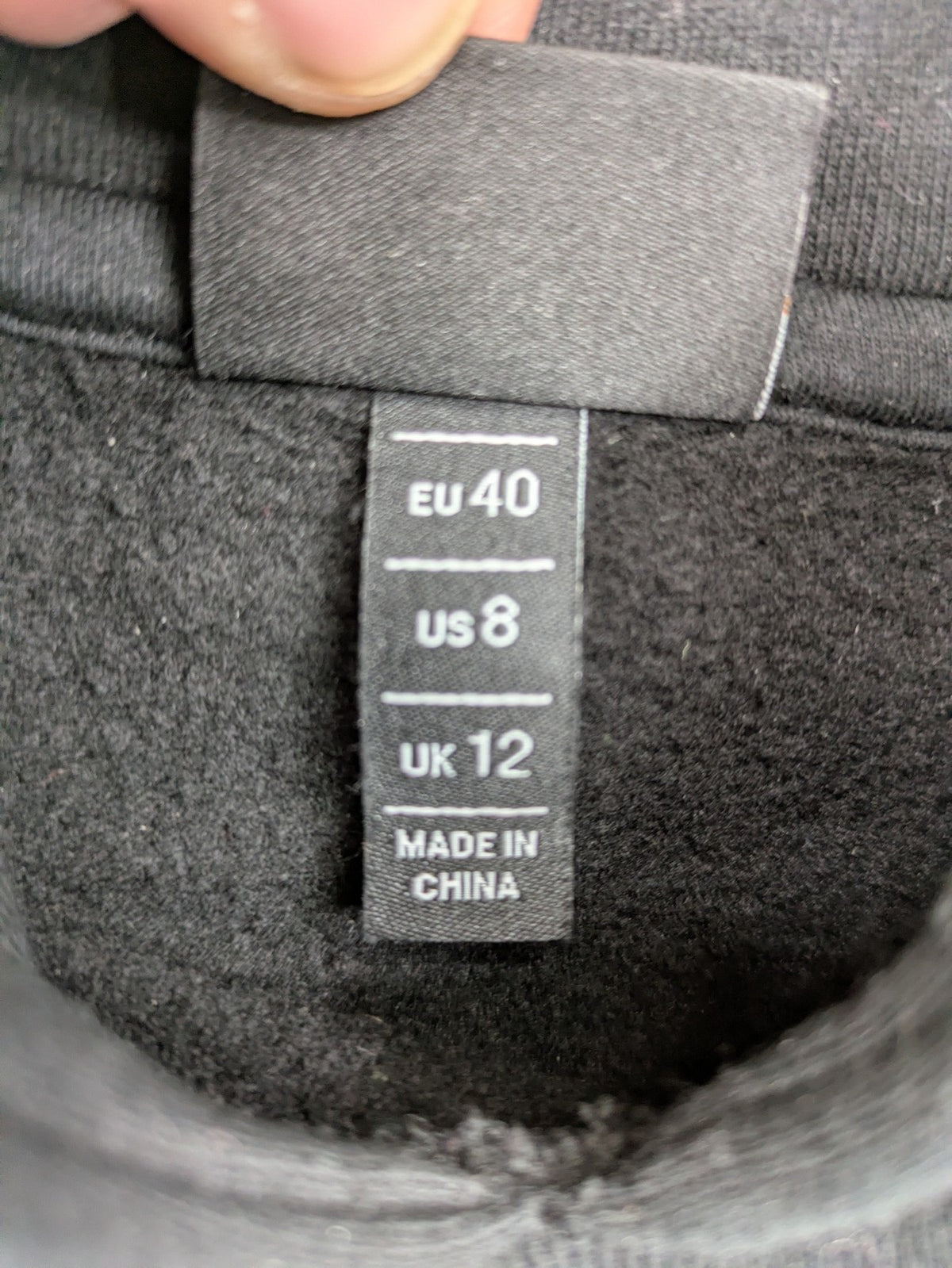 Ellesse grey hoodie with large logo, kangaroo pocket, and drawstring hood.