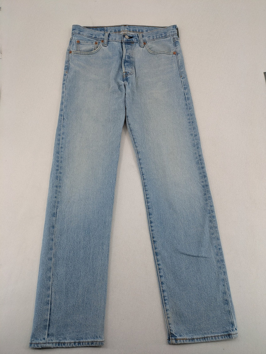 Levi's blue straight jeans light wash denim with button fly and classic fit.