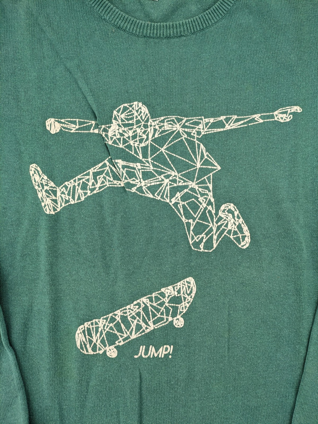 BESTies green turtle neck jumper with white skateboard graphic and ribbed cuffs.