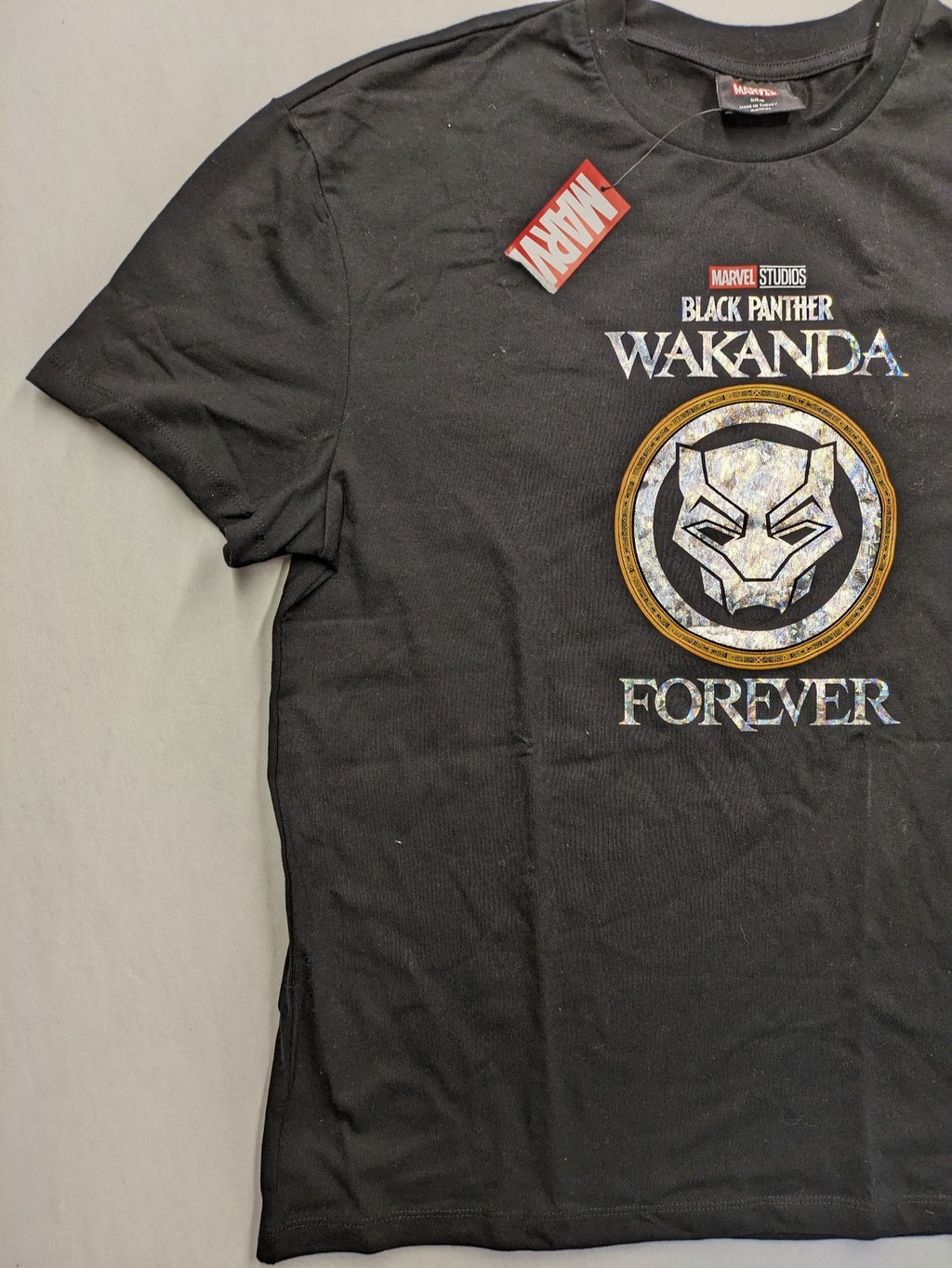 Black Panther black t-shirt foil graphic of Black Panther emblem and text.