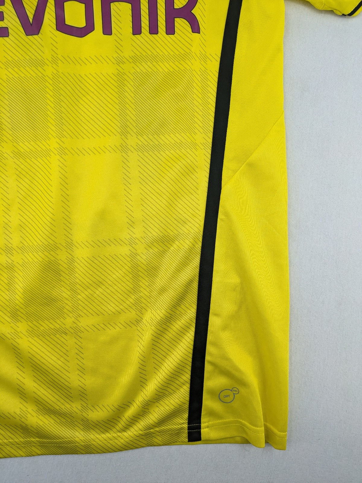 Borussia Dortmund black and yellow soccer uniform with DFB Pokal 2014 patch and Puma logo.
