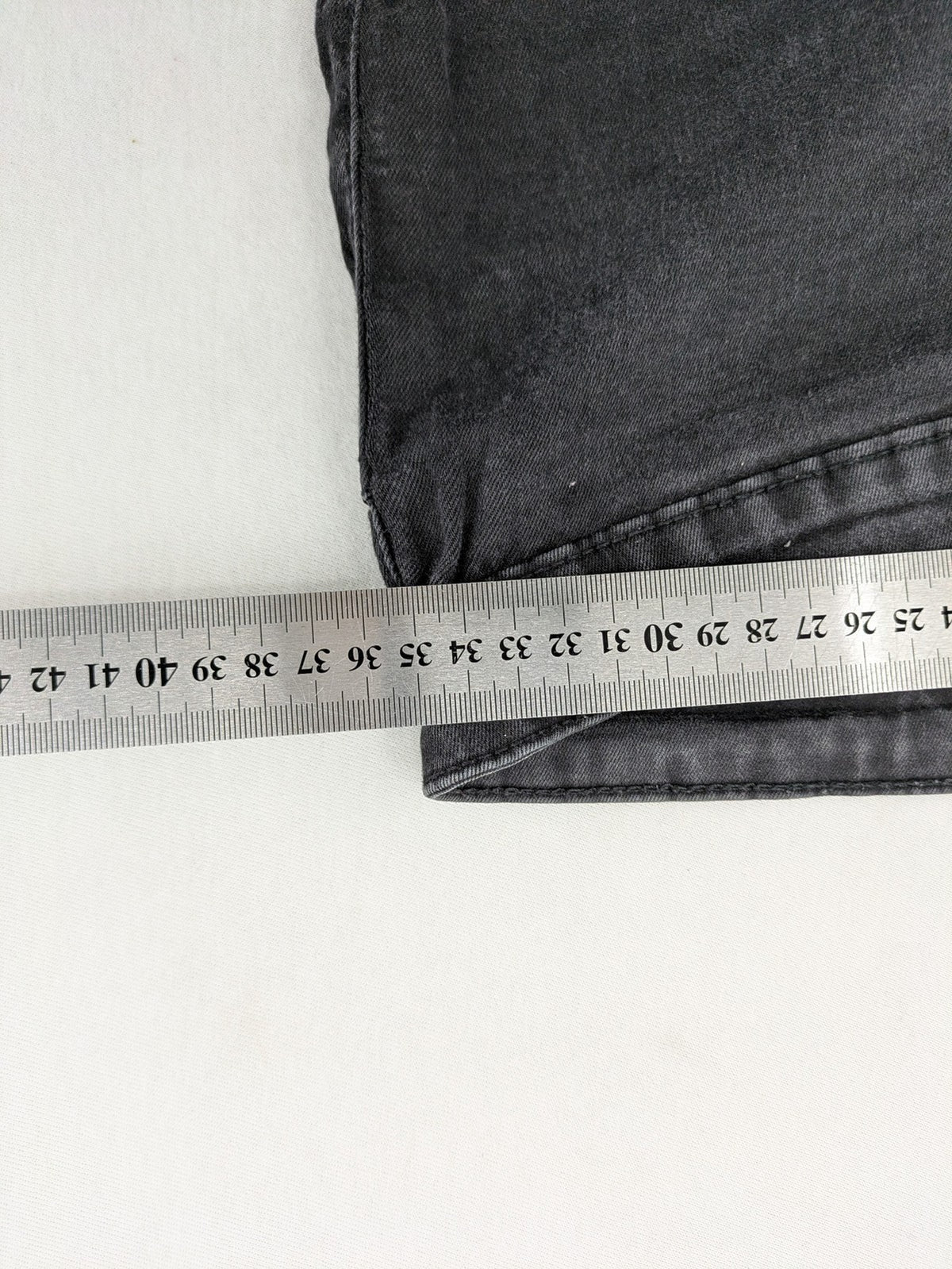Denim & Co. black skinny jeans high waist stretch denim with washed finish.