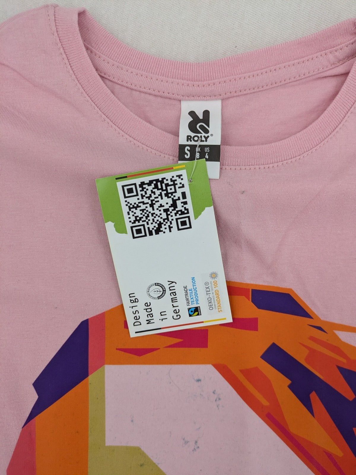 Marilyn Manson pink band t-shirt with colorful graphic portrait and "MM" logo.