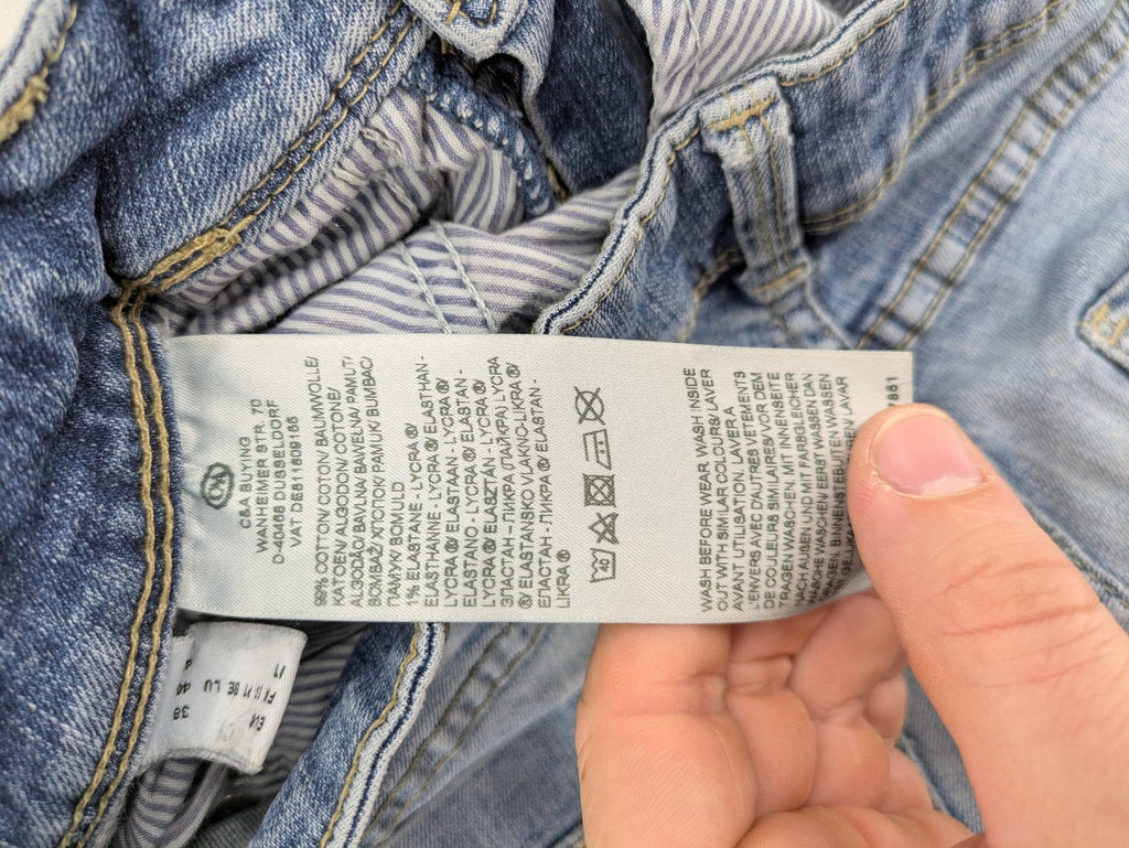 C&A blue bootcut jeans with faded denim and low rise fit, made from cotton blend.