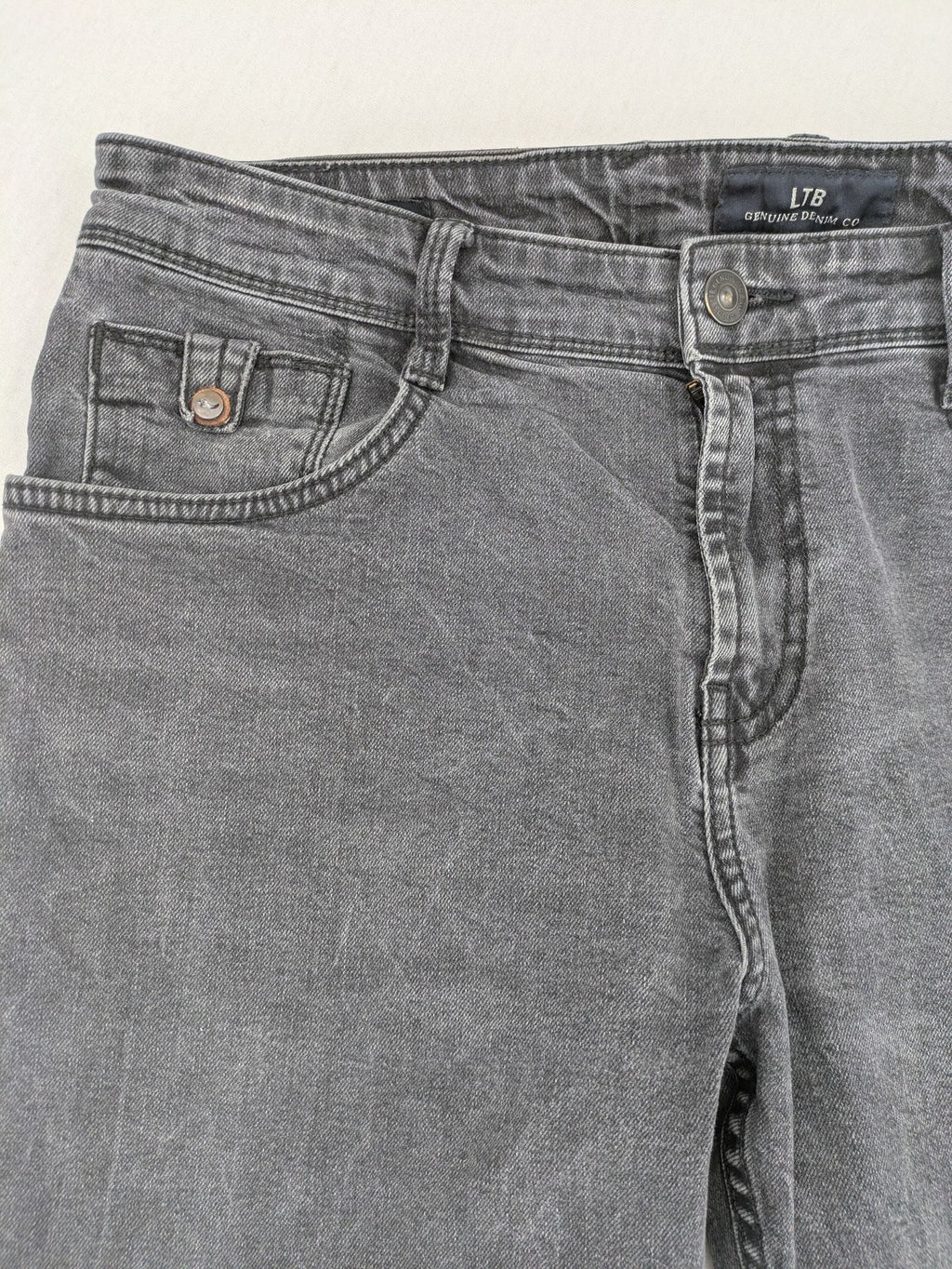 LTB grey slim tapered jeans with washed denim finish and subtle logo detail.