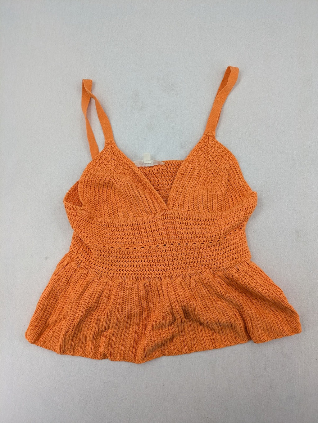 REVIEW orange crochet top with V-neck and peplum hem, made from 100% cotton.