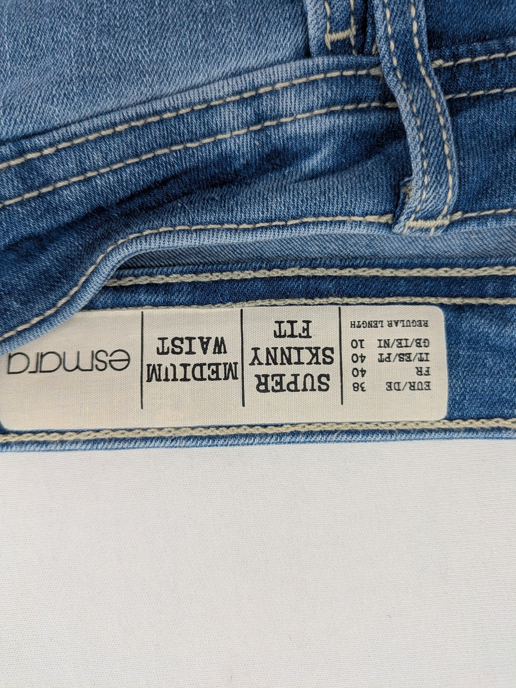 ESMARA blue super skinny jeans with medium waist and stretchy cotton blend material.
