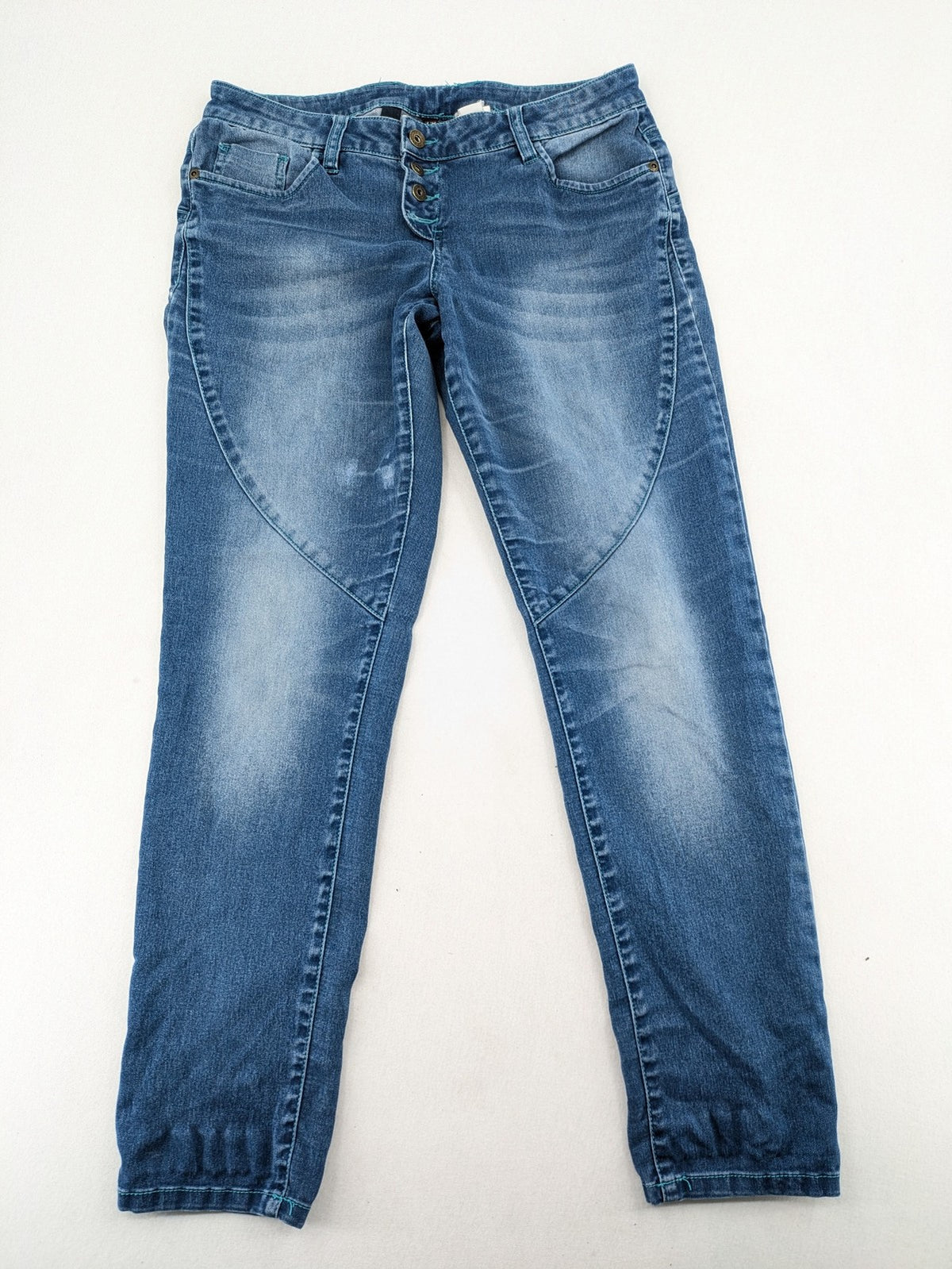 Rainbow blue straight jeans jogger style with button fly and contrasting turquoise stitching.