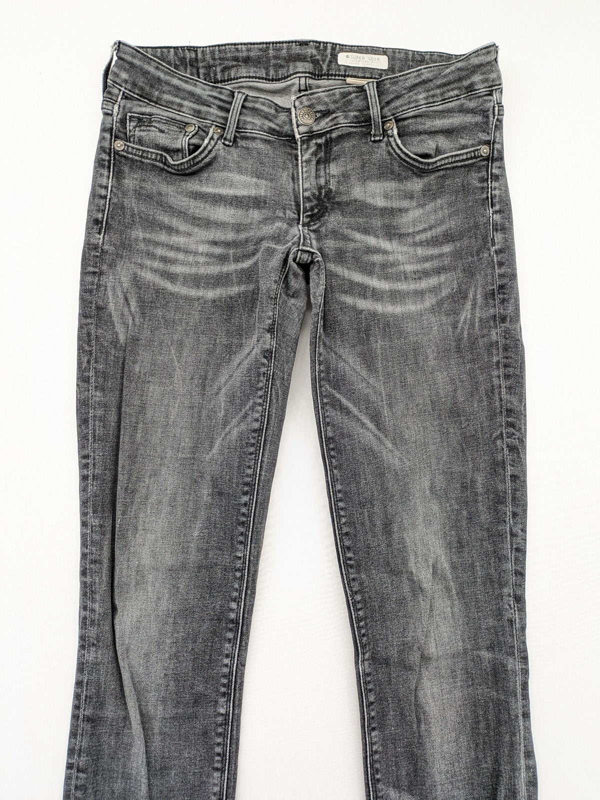 H&M grey skinny jeans with low rise, classic 5-pocket style, and washed denim finish.