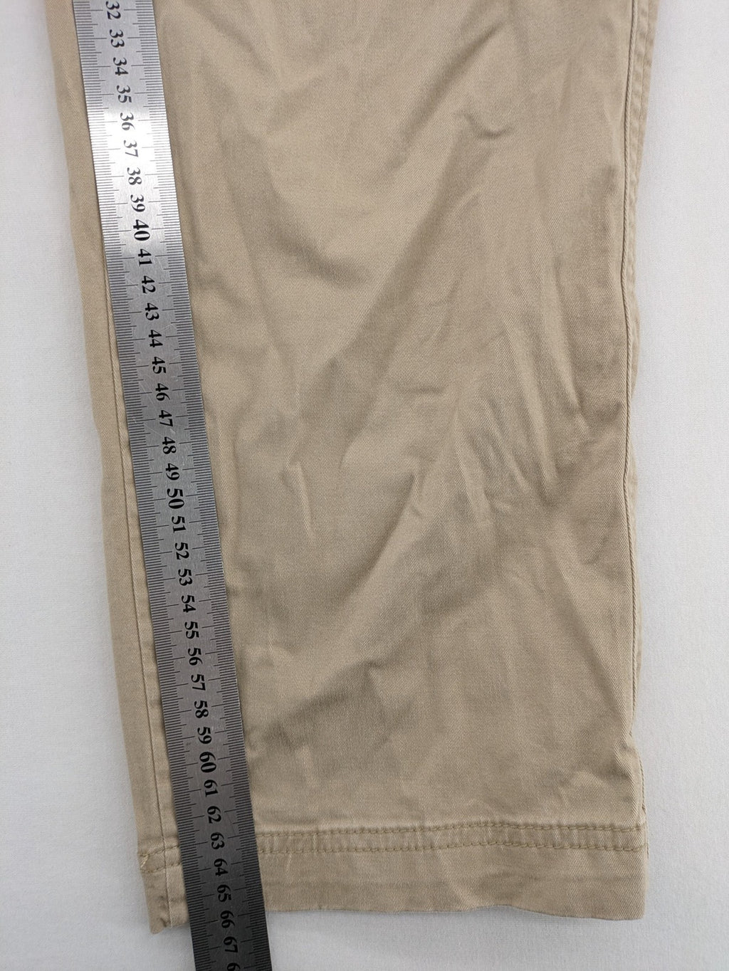 Gap beige girlfriend chino pants with relaxed fit and soft cotton-stretch blend.