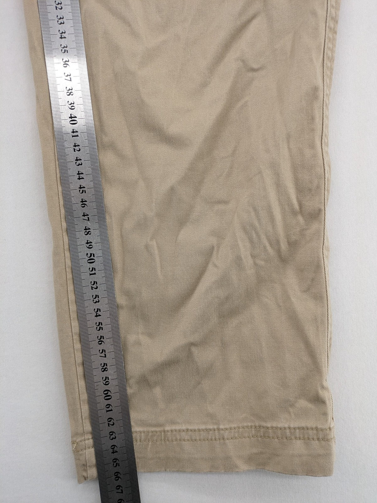 Gap beige girlfriend chino pants with relaxed fit and soft cotton-stretch blend.