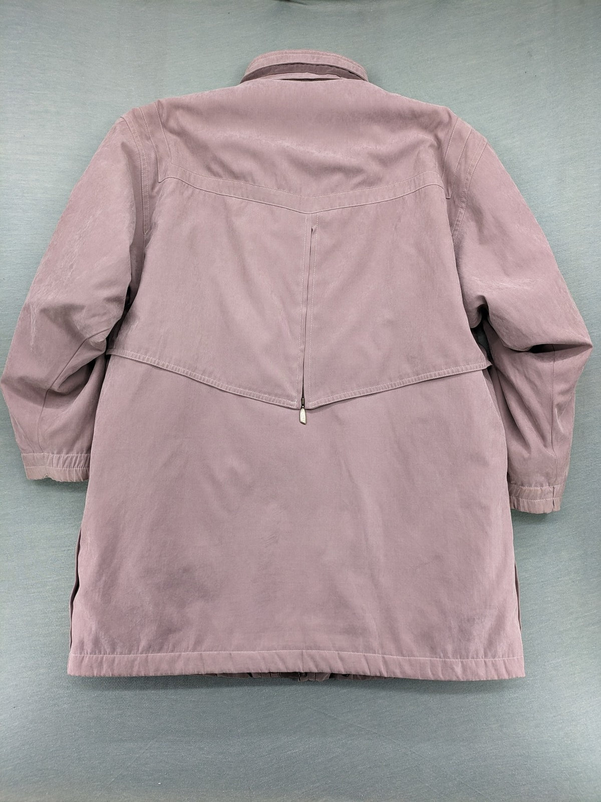 Goldix beige coat with checkered lining and Sympatex waterproof technology.