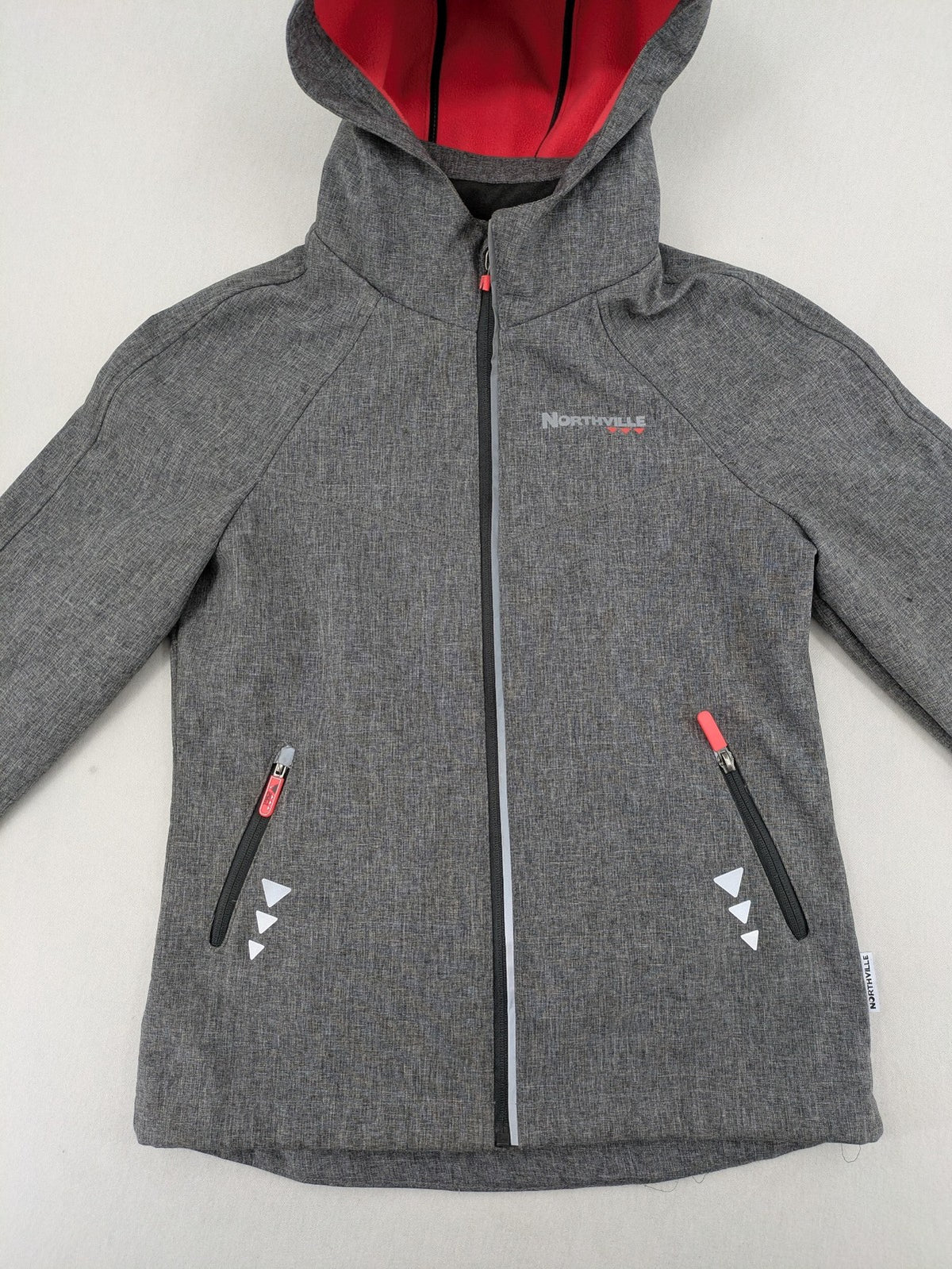 Northville grey and red softshell jacket with hood, fleece lining, and reflective elements.