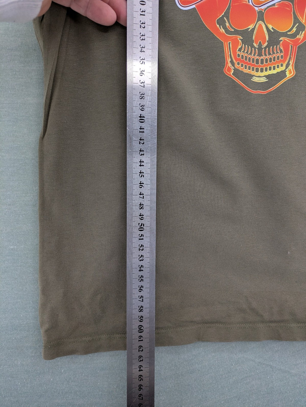 Aerosmith khaki band t-shirt featuring large flaming skull graphic and logo, slim fit.