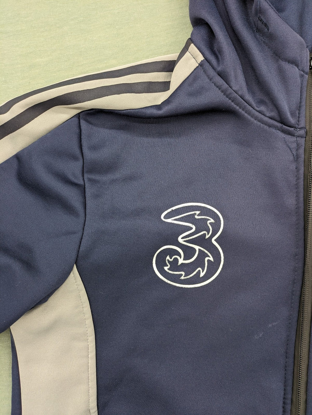 Chelsea FC grey and navy tracksuit set with full zip hoodie and three logos.