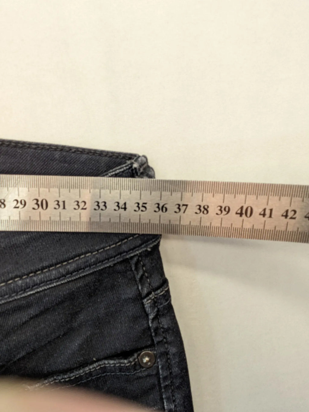 Jack & Jones grey slim fit jeans with classic 5-pocket style and button closure.