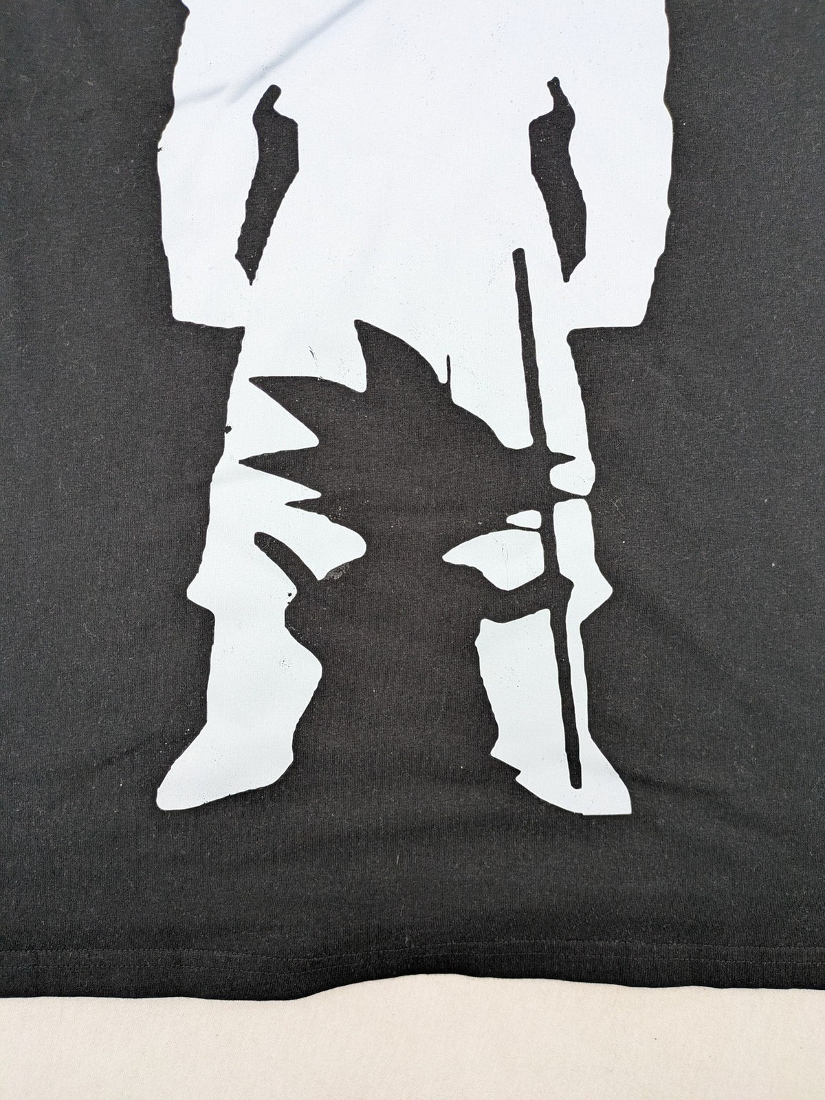 Dragon Ball Z black t-shirt featuring blue Son Goku silhouette graphic design.