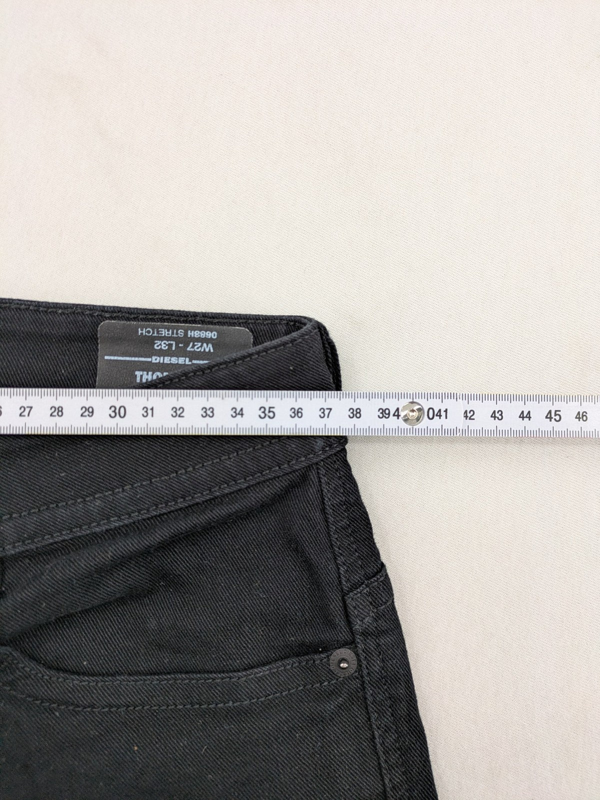 Diesel black Thommer Slim jeans with classic 5-pocket design and stretch material.