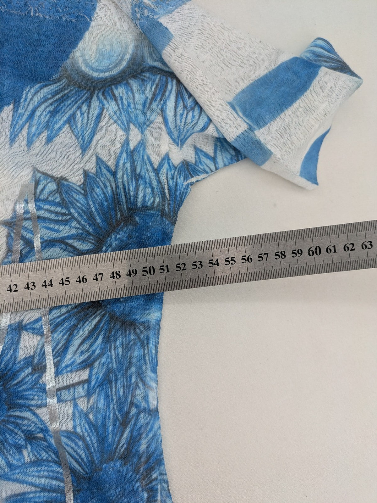 Liberty blue floral print top with metallic "LOVE" lettering, lightweight polyester material.