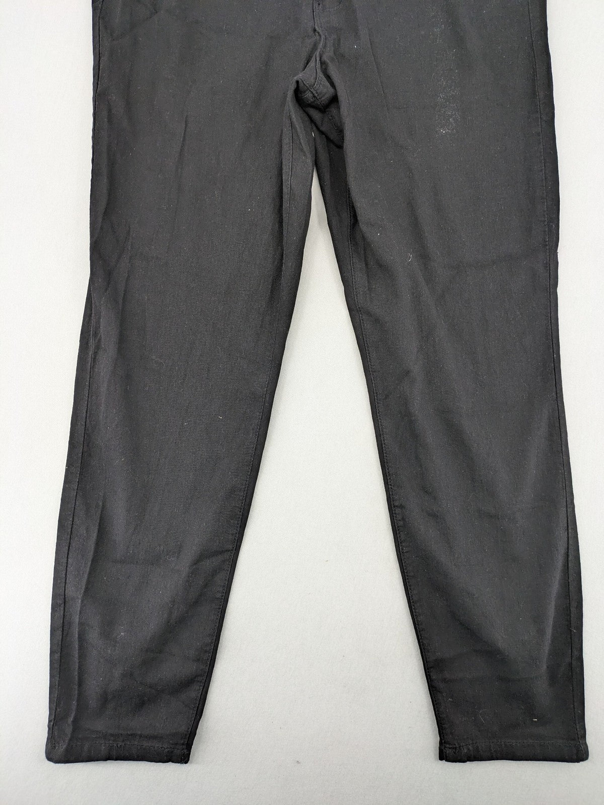Denim & Co. black straight jeans with front button closure and back pockets.