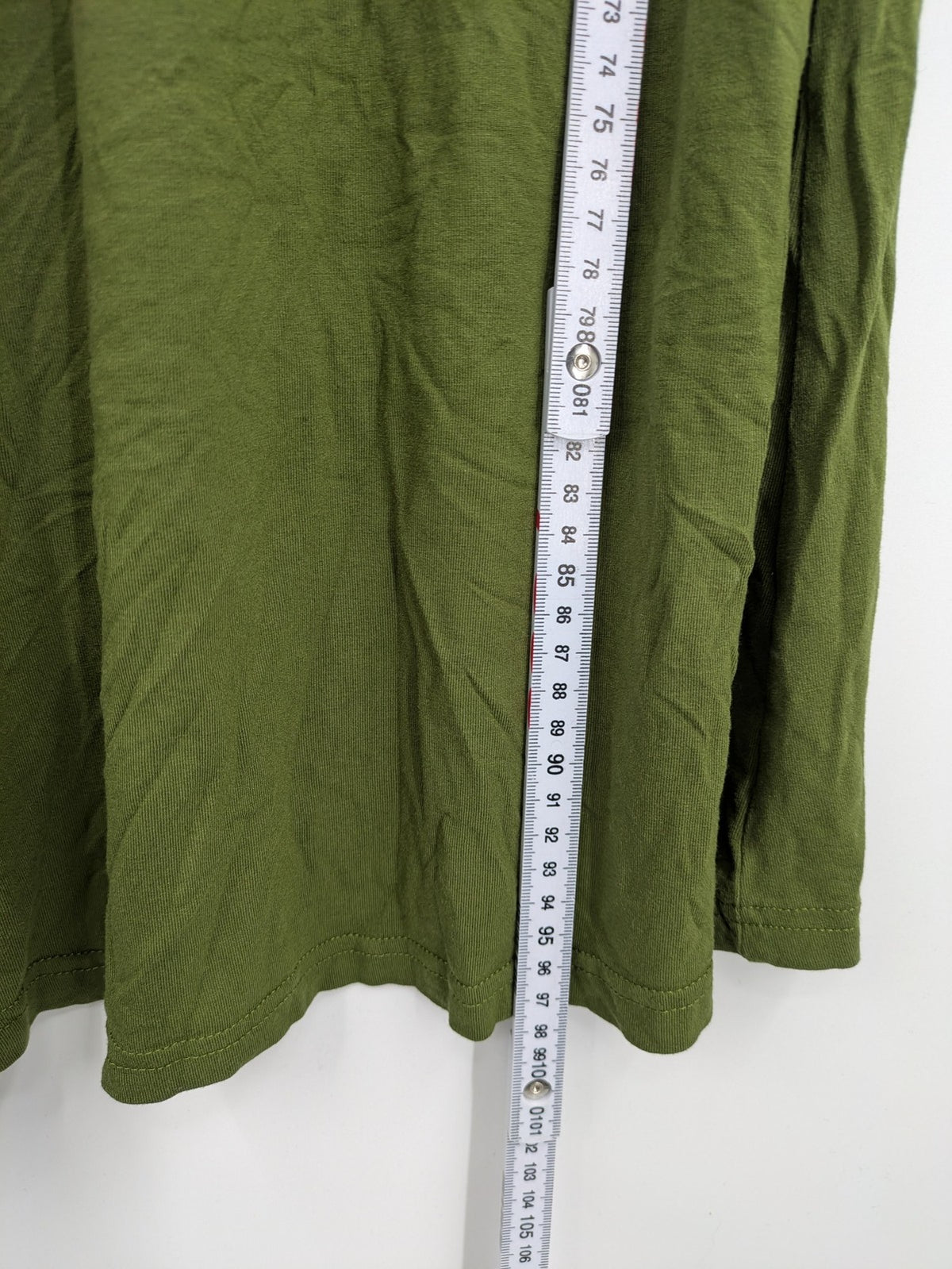 Bonprix green maternity dress with layered V-neck and empire waist design.