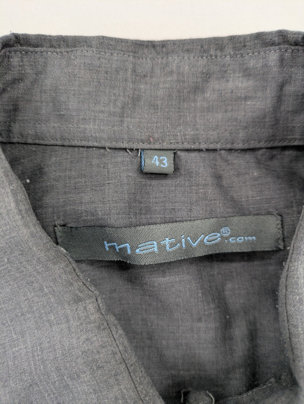 Mative pink button-up shirt with classic collar, chest pocket, cotton-polyester blend.