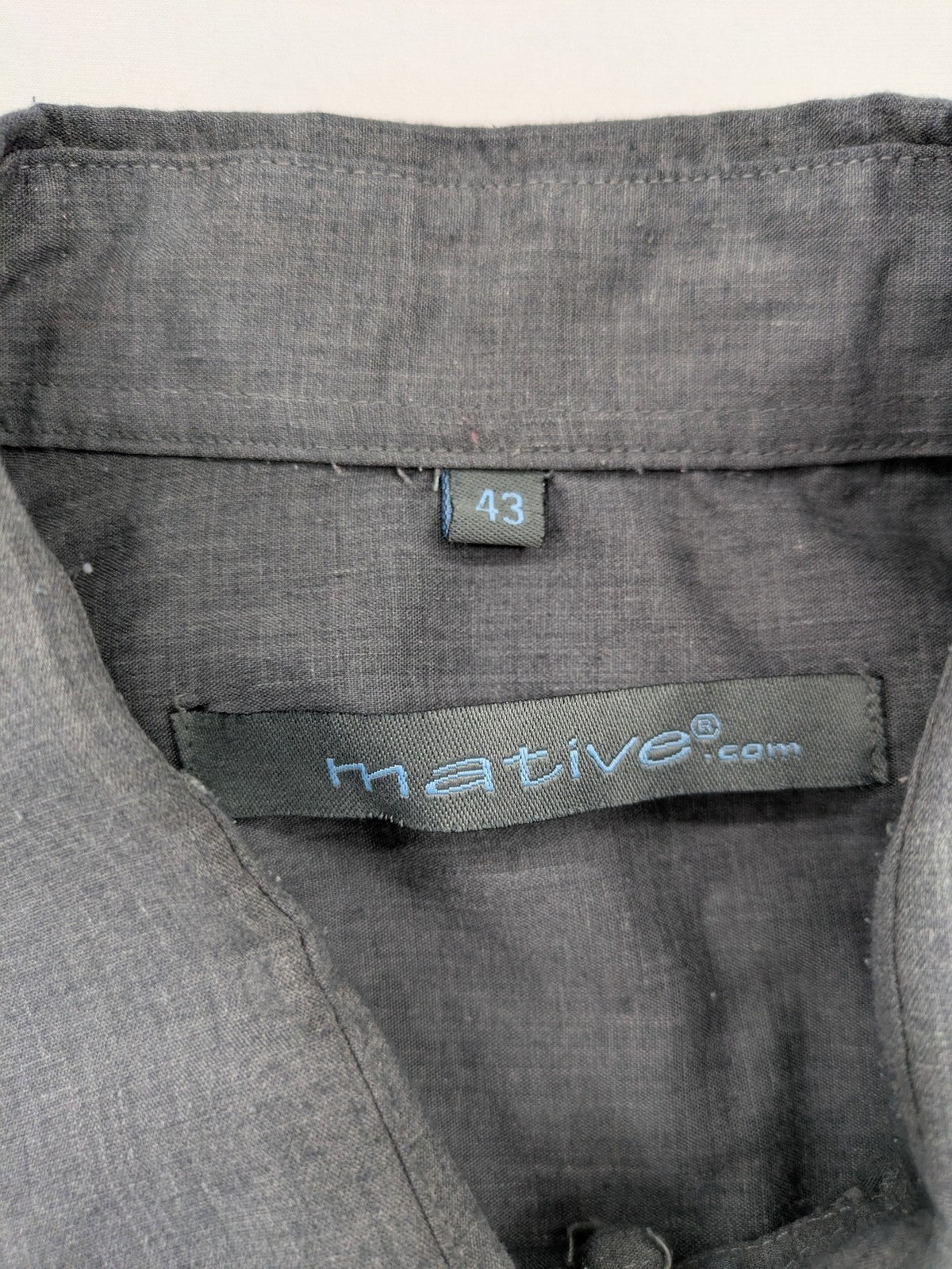 Mative pink button-up shirt with classic collar, chest pocket, cotton-polyester blend.