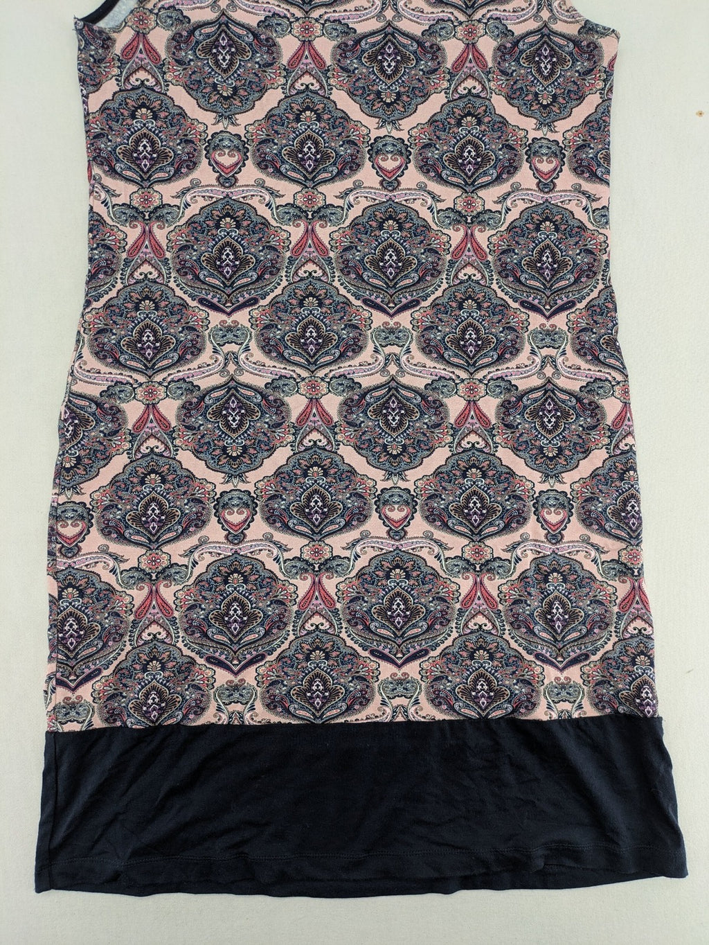 Montego pink sleeveless dress with paisley pattern and black hem, made of viscose.
