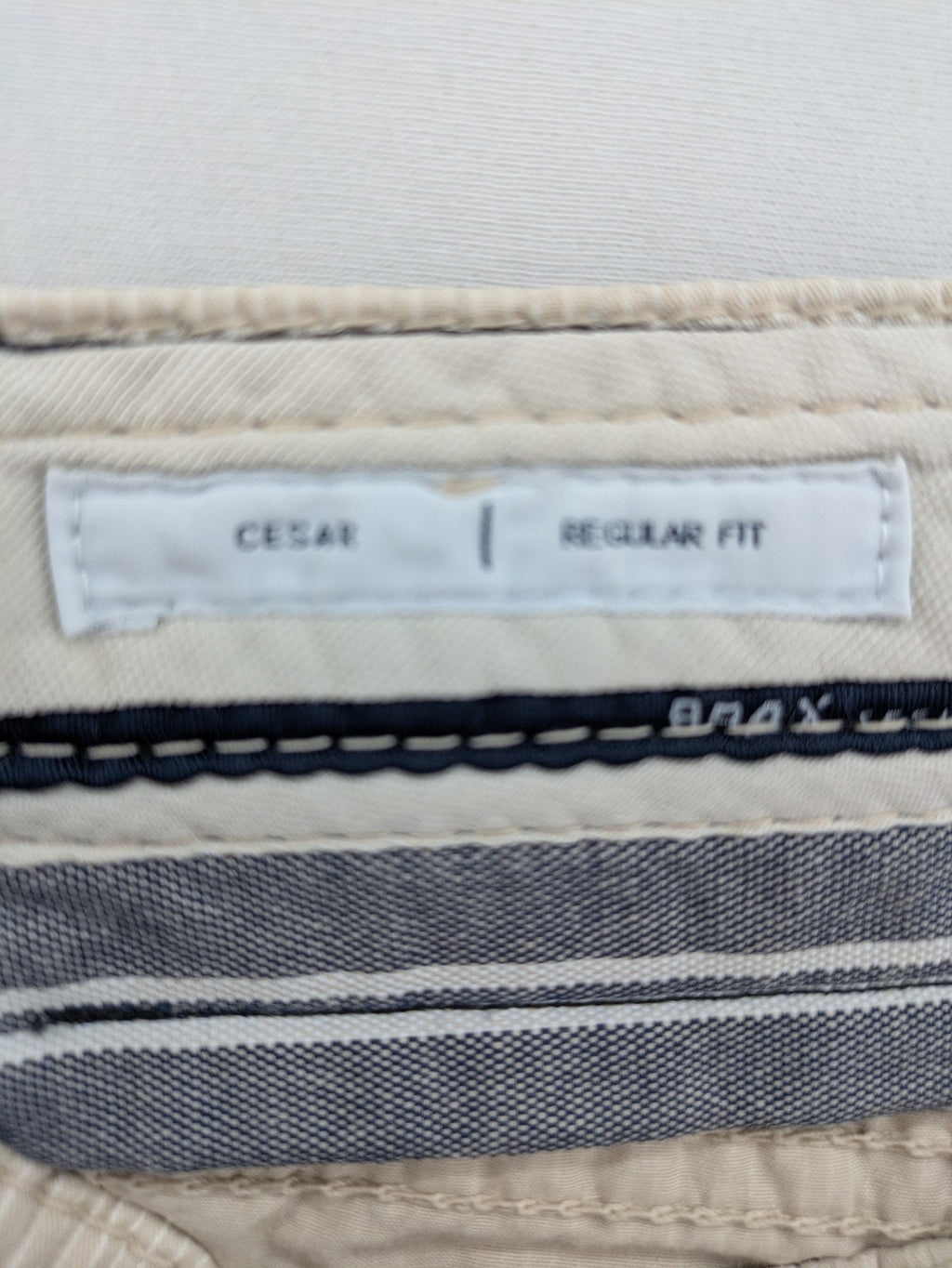 BRAX beige striped pants with logo, made from comfortable stretch cotton blend.