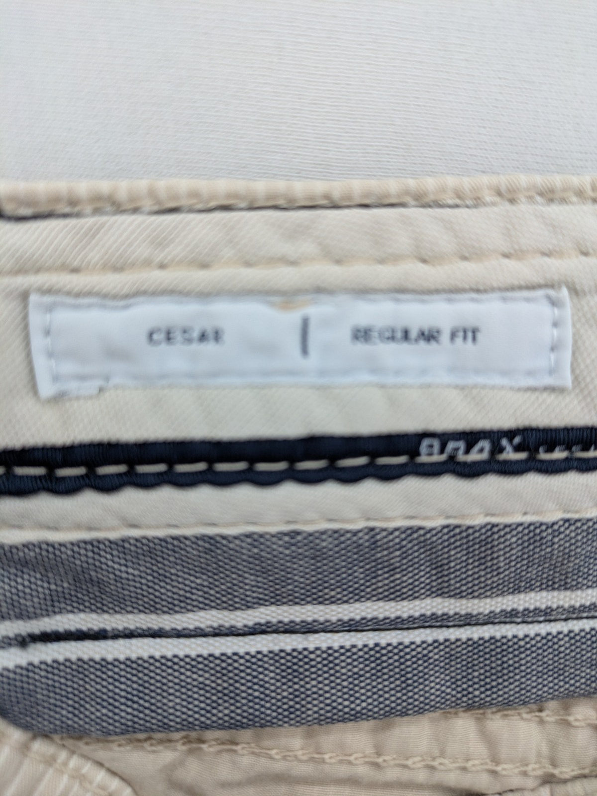 BRAX beige striped pants with logo, made from comfortable stretch cotton blend.