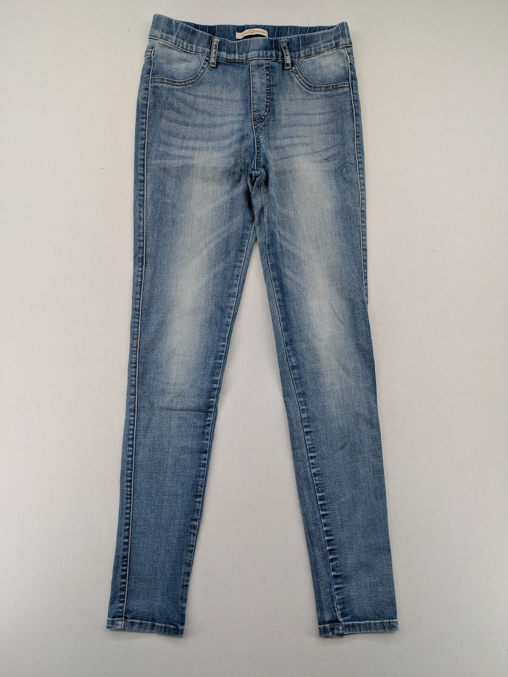 Miss Bonbon blue skinny jeans jeggings with elastic pull-on waistband and light wash.