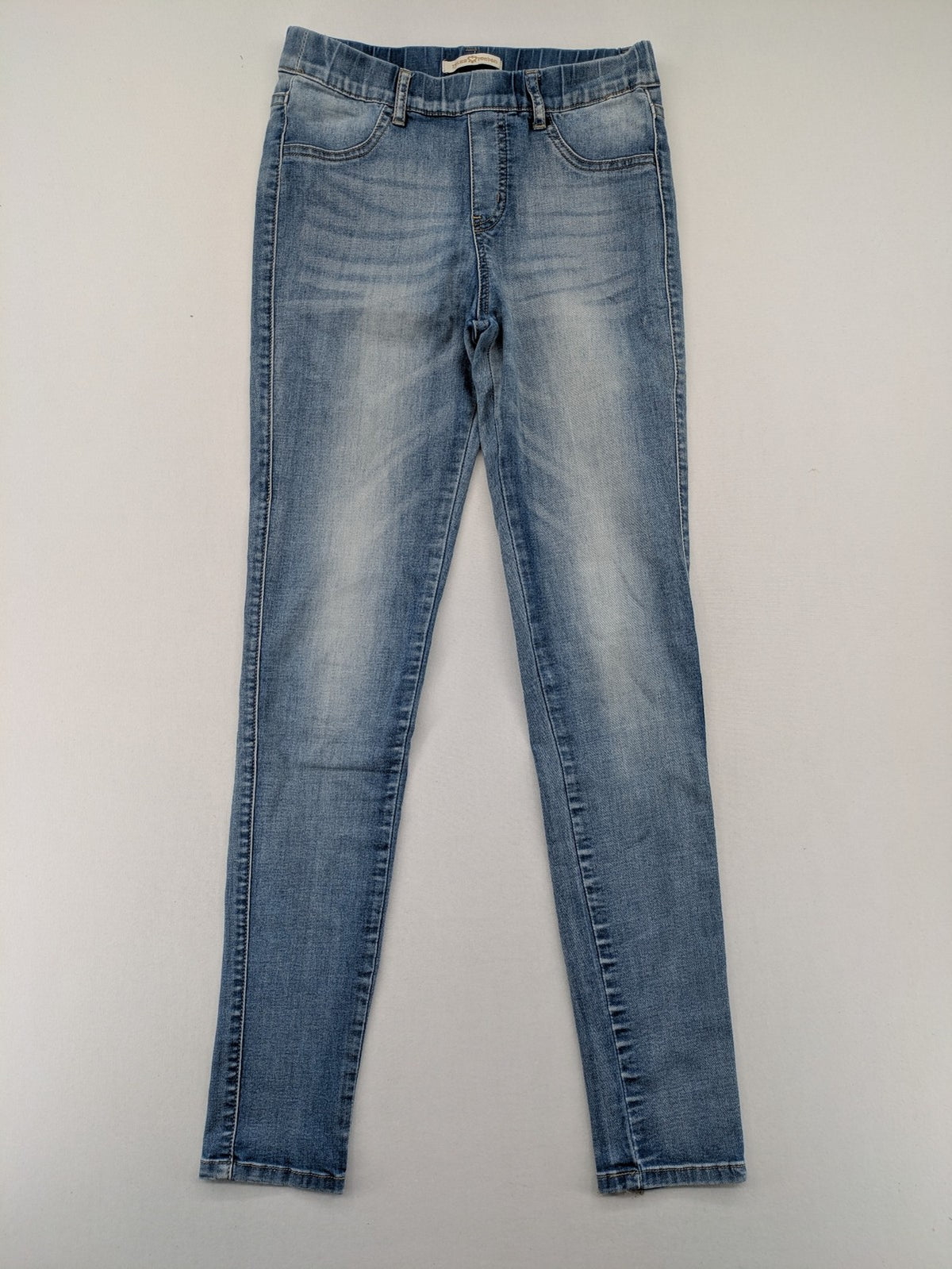 Miss Bonbon blue skinny jeans jeggings with elastic pull-on waistband and light wash.