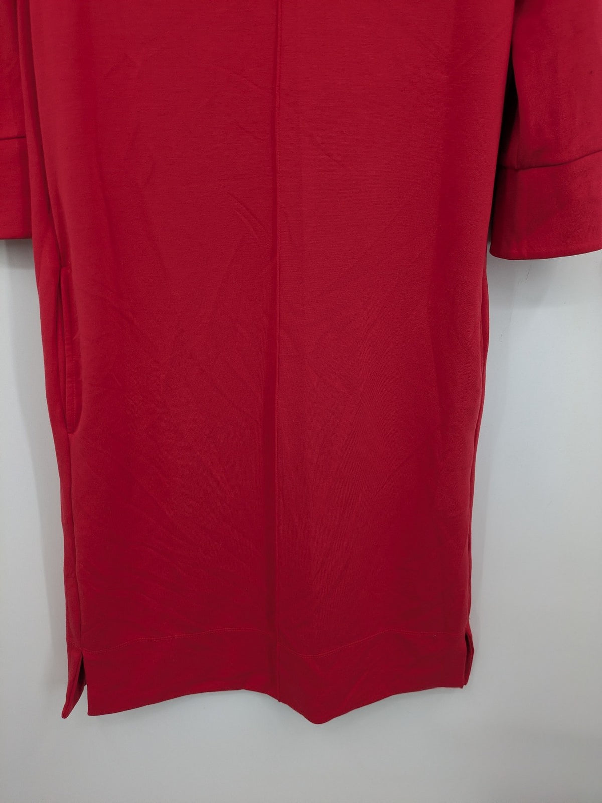 H&M red A-line dress with stand collar, 3/4 sleeves, and side pockets in stretchy jersey.